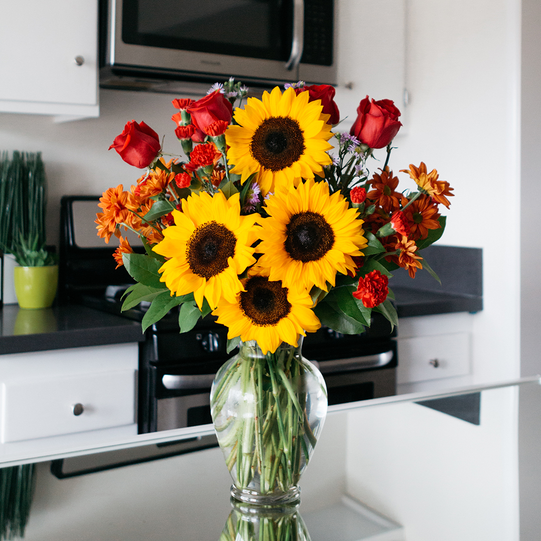 sunflowers with red roses