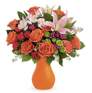 Orange flowers fill an orange vase